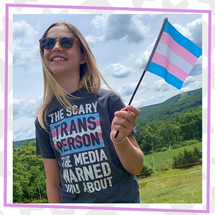 Rebekah Bruesehoff, Teen Activist, poses proudly with a transgender pride flag