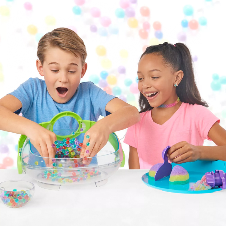 Lifestyle photo of two kids playing with the Orbeez Challenge Activity Kit