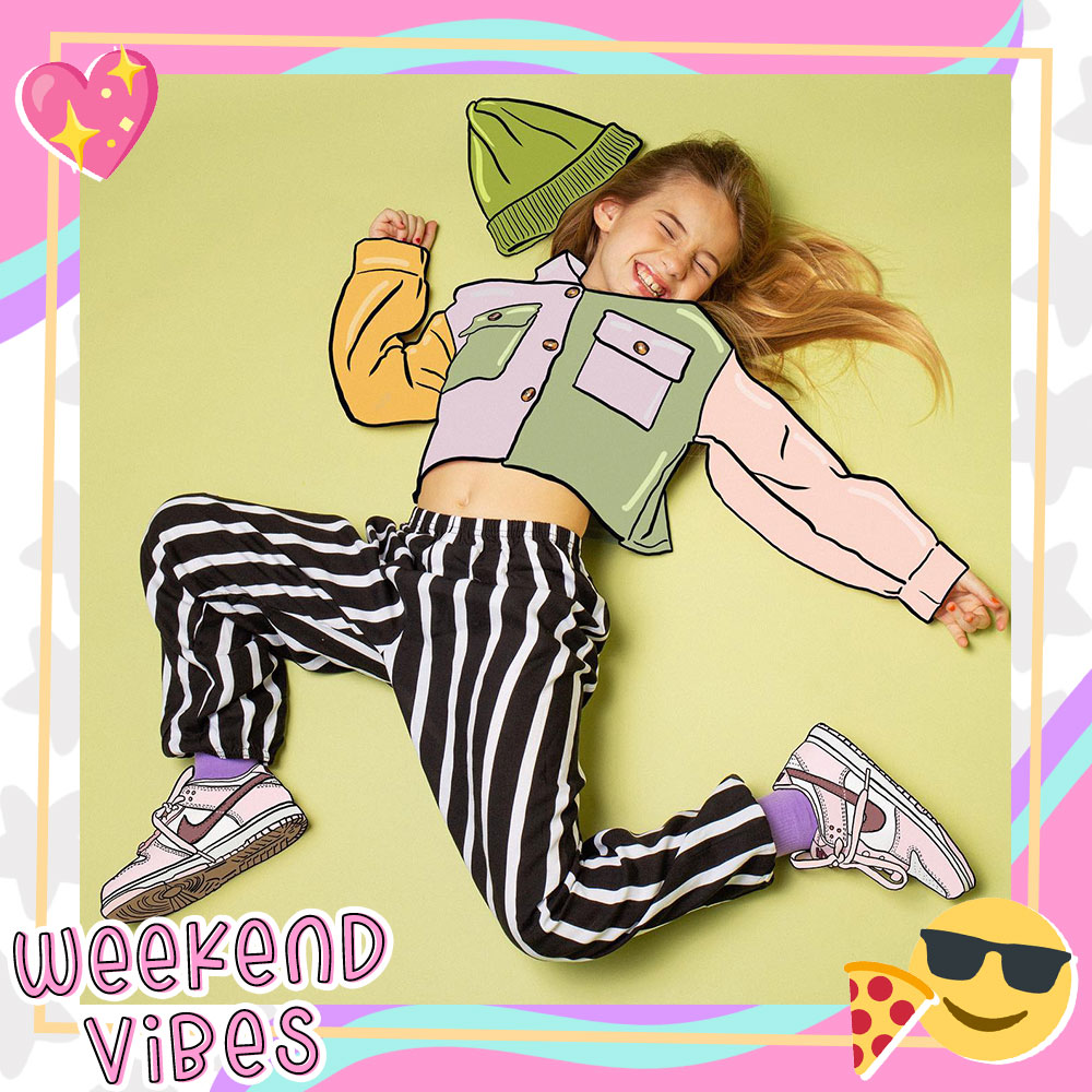 Photo of Mandy laying on the ground in an illustrated outfit.