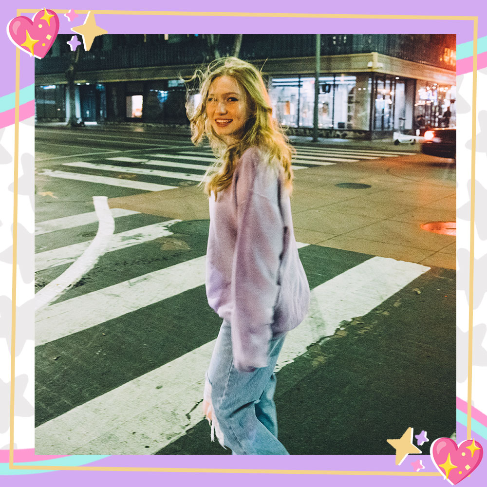 Abigail Lewis posing in a city crosswalk