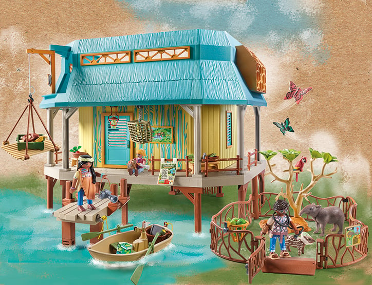Lifestyle photo of the fully assembled PLAYMOBIL Animal Care Clinic set in front of a jungle inspired backdrop