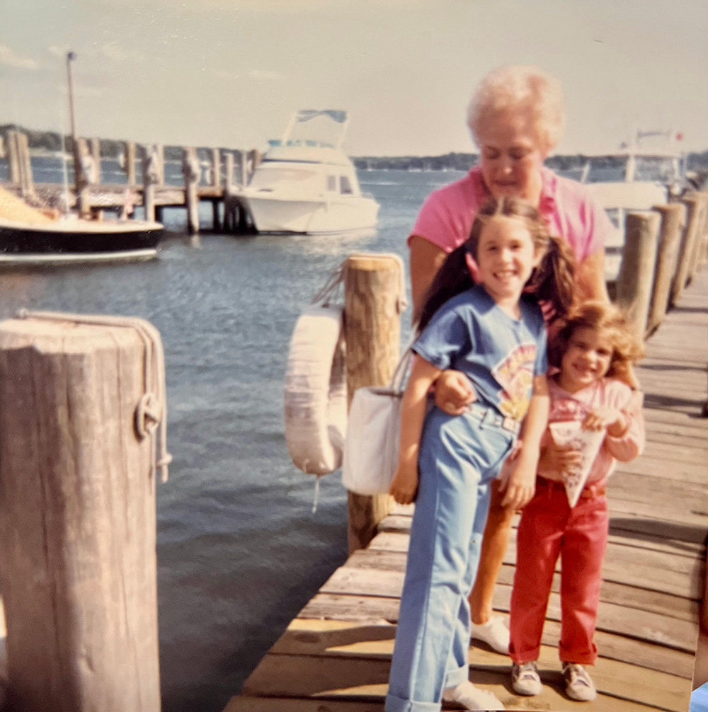 Jen Calonita and her sister Kathleen as kids, standing with their grandmother on a pier in Greenport, NY